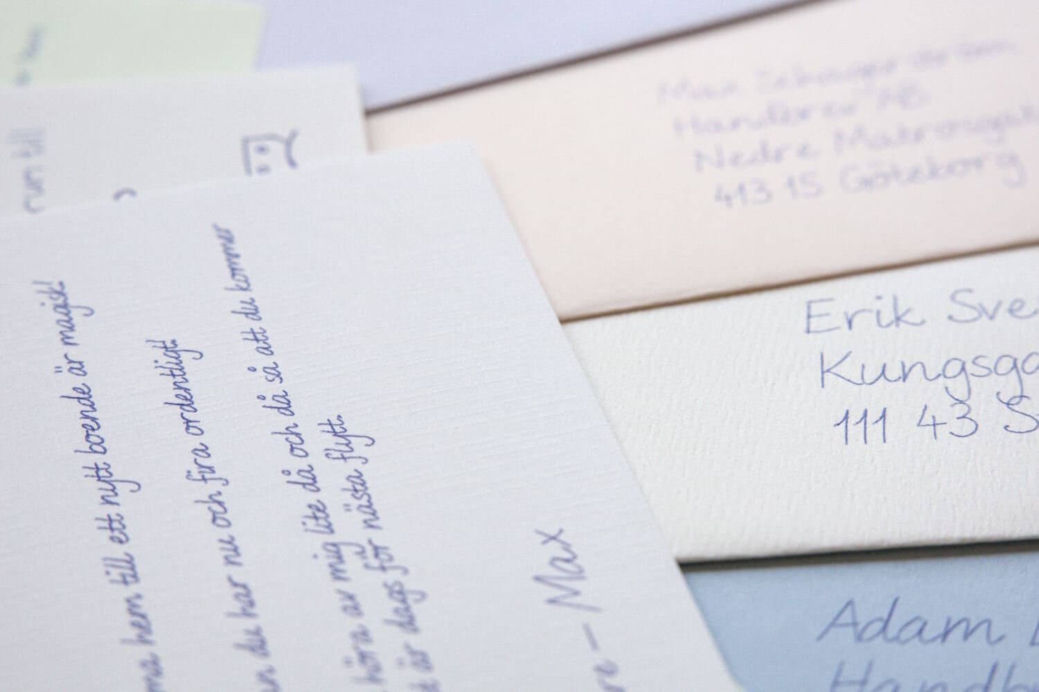 Handwritten letters and envelopes in different colours